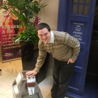 Tim Bradley with K-9 standing outside the TARDIS at 'Dimensions 2015', Newcastle, October 2015